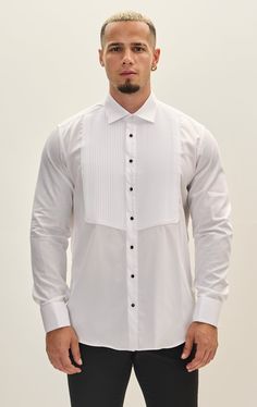 The Pure Cotton Pleated Classic Collar Tuxedo Shirt is a timeless and elegant piece, crafted from 100% high-quality cotton. It features a classic collar and meticulously pleated front, offering a sophisticated look perfect for formal occasions. Designed for comfort and style, this shirt ensures a polished appearance with its fine detailing and superior fabric. Designed with meticulous attention to detail, this tuxedo shirt features French cuffs, allowing you to accessorize with your favorite cuf White Elegant Cotton Dress Shirt, Elegant White Cotton Dress Shirt, Luxury Long Sleeve Dress Shirt For Wedding, White Tailored Top For Formal Occasions, Tailored White Tops For Formal Occasions, White Elegant Shirt With Spread Collar, Elegant White Shirt With Spread Collar, Elegant White Dress Shirt With Spread Collar, Formal White Custom Fit Shirt