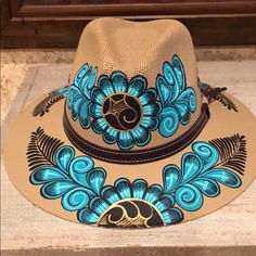 Beautiful Artistic Hand Painted Hat Colors: Tan, Aqua, Gold, Brown Size: Medium Quality Well Made Collection Hat Decorative Hat Hand Painted Boho 2024, Painted Caps, Art Hats, Hat Painting, Cowboy Hat Design, Hat Burning, Vacation Hat, Hat Bar, Painted Clothes Diy