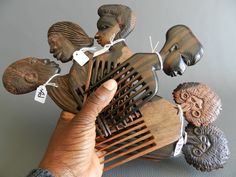 African comb Sculpture bust man woman monkey luxury ebony wood, African comb African black man bust, African Art, hairstyle, vintage - Bust Man Sculpture, African comb Black man, wooden, African art luxury ebony wood figurine, hair accessory, vintage - Black and brown love sculpture in exotic wood from Africa - dark black and light brown ebony - to be used for hairdressing or for home art decoration sold individually - Dimensions: approximately 20 cm x 7 cm Exclusivity at La Maison Rafacia African Hair History, African Comb, Sculpture Bust, Afrocentric Decor, Natural Hair Accessories, African Colors, African Artwork, Adinkra Symbols, African Sculptures