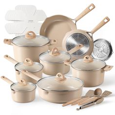 an assortment of pots and pans with wooden utensils