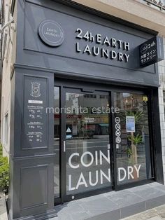 the front of a building that sells coin laundry