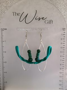 Hello & Welcome! In this listing you will find a unique, handcrafted, pair of wire teardrop statement earrings. Made using 16 gauge silver artistic wire, teal green flex strips, 8mm hunter green rubberized beads, forest green silicone spacer beads, 6mm dark green acrylic beads, nickel free stainless steel jump rings & earring hooks, and lots of love. They are comfortable to wear. You will receive the exact pair that is shown in the photos. Free gift wrapping is available. If you're sending them as a gift, please mark the gift option or send me a message. If you have any questions, feel free to send me a message & I'll be happy to assist you.  Spice up your jewelry collection with this amazing pair of handcrafted earrings. Thanks for taking a look & have yourself a beautiful day!♥ Adjustable Teardrop Wrap Earrings As Gift, Adjustable Teardrop Wrap Earrings For Gift, Handmade Adjustable Green Wrap Earrings, Adjustable Handmade Green Wrap Earrings, Adjustable Teardrop Green Jewelry, Adjustable Green Teardrop Jewelry, Green Teardrop Metal Earrings, Green Adjustable Teardrop Jewelry, Modern Handmade Green Hoop Earrings