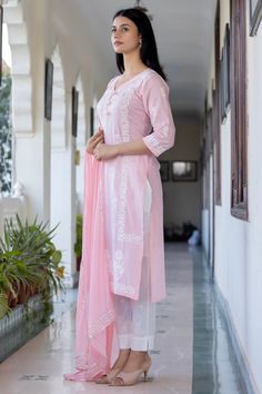 This is a 3-piece set. The set consists of straight cut zari embroidery detailing kurta has v neck, 3/4th sleeves, calf length teamed with trouser pants with side pockets and a dupatta. 3-piece set Color-Pink Fabric-Cotton Kurta Length-Calf Length Sleeves-3/4th Sleeves Neck-V Neck Work-Embroidery Detailing Washing Care-Regular Wash or Machine Wash Coat Suits For Women, Chikankari Suits, Zari Embroidery, Suit Set, Suits Coats, Embroidery Details, Pink Fabric, Trouser Pants, Pink Cotton