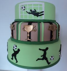 three tiered cake with soccer themed frosting