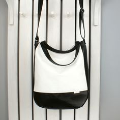 Are you looking for a large custom vegan black and white bag for women? Great - you are in a good place. This simple minimalist purse of faux leather is just for you and meet all your needs. You can carry it as handbag, hobo shoulder and slouchy crossbody tote. It easily changes to messenger. Very practical. Fastened with a zipper. Fits everything you need inside - your cosmetic bag, magazines, documents for work or school, phone, keys and many other things, you always need to have with you. Gre Minimalist Purse, Black And White Bags, Cross Shoulder Bags, Hobo Tote Bag, Canvas Leather Bag, White Shoulder Bag, Handmade Tote, Vegan Leather Bag, Shopper Tote