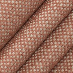 the texture of an orange and white tweed fabric