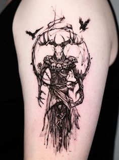 a black and white tattoo on the back of a woman's arm with an image of a demon