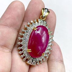 "This gorgeous, vivid, HUGE CABOCHON-Shaped, Burmese Ruby and stunning, impeccably graded F/VS Diamonds will totally melt everyone's heart! EXTREMELY RARE ENORMOUS 40.89 CARATS BURMESE RUBY with ATTRACTIVE, VIVID, HOT-PINKISH-RED color. SET IN FINE 18K SOLID YELLOW GOLD HANDCRAFTED PENDANT! ONLY ONE ITEM AVAILABLE!! WHAT YOU SEE IN THE PICTURES IS WHAT YOU WILL GET   \"You will get the best GEMSTONES from the most experienced GEMS wholesaler in the world.\" SUGGESTED RETAIL VALUE: $35,000 RUBY: Exquisite Ruby Jewelry Gia Certified, Unique Red Diamond Jewelry, Dazzling Gia Certified Ruby Jewelry, Handmade Luxury Ruby Jewelry, Luxury Gia Certified Gold Necklaces, Exquisite Red Cabochon Jewelry, Burmese Ruby Necklace, Ruby Cabochon Pendant Jewelry, Luxury Red Cabochon Necklaces