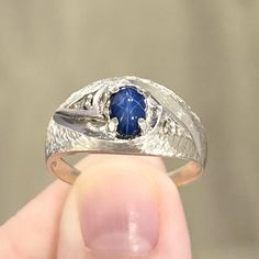 Nice, Elegant, And Vintage, Large Thick Linde Style Star Sapphire Solitaire/Statement Ring! Featuring A Deep Blue Lab Created 7x5mm Star Sapphire Oval Cabochon, And Two 0.0066 Carat Diamond Accents; Set In 10k Solid White Gold (Which Both A Brushed And Shiny Finish). Marked 10k And Acid Tested This Ring Is A Size 11.5 This Ring Weighs 4.50g This Ring Measures 11mm From The Front; And 2mm From The Back Of The Band. Vintage Condition: Good (Some Minor Wear On The Band/Setting; Some Minor Oxidation Vintage Gold Ring, Vintage Gold Rings, Style Star, Sapphire Solitaire, Star Sapphire, Blue Vintage, Diamond Sizes, Oval Cabochon, Sapphire Diamond