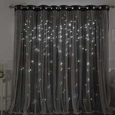 the curtains are covered with white lights