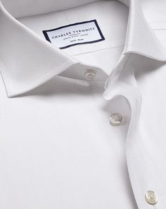 100% cotton, Available in slim and extra slim fit, Non-iron, Modern spread collar, Split yoke for optimal fit and comfort, Slim fit: back pleats for ease of movement, Extra slim fit: streamline back darts, Mitred two-button cuff or square French cuff, Complimentary brass collar stays, Machine washable - Cutaway Collar Non-Iron Herringbone Shirt - White | Men's Charles Tyrwhitt Cutaway Collar Non-Iron Herringbone Dress Shirt - White Single Cuff Size Small Cotton Fitted Collared Timeless Top, Fitted Timeless Collared Top, Timeless Fitted Collared Top, Tailored Short Sleeve Formal Tops, Classic Top With Concealed Placket, Classic Tailored Office Tops, Classic Tailored Tops For Office, Classic Tailored Office Top, Timeless Fitted Top For Business Casual