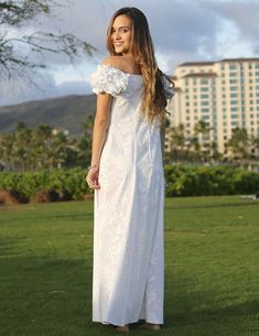 Maxi style dress, solid white background with accented white floral tropical design available in plus-size 100% Cotton Poplin Fabric Square Ruffled Neckline Ruffled Elastic Shoulders and Cap Sleeves Front and Back Flattering Darts Center Back Zipper Color: White Sizes: XS - 4XL Care: Machine Wash Cold, Cool Iron Made in Hawaii - USA SIZE XS0-2 S4-6 M8-10 L12-14 XL16-18 2XL20-22 3XL24-26 4XL28 BUST 31" 33" 35" 37" 40" 42" 44" 46" WAIST 34" 36" 38" 40" 42" 44" 46" 48" HIP 38" 40" 42" 44" 46" 48" 50" 52" LENGTH 51" 52" 53" 54" 55" 56" 56" 57" These measurements are from the garment and not from the person, measured on a flat surface from inseam to inseam. To select your size, we recommend measuring your garment and comparing it to this chart White Hawaiian Dress For Spring, White Hawaiian Spring Dress, White Hawaiian Dress With Hibiscus Print, White Hibiscus Print Dress For Spring, White Tropical Maxi Dress, Hawaiian Wedding Dress, Honolulu City, Easy Wear Dresses, Sarong Dress