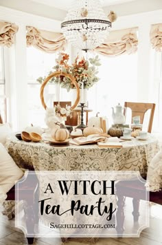 a witch tea party with pumpkins, candles and other items on the dining room table