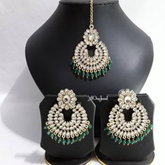 Beautiful handcrafted large earrings and tikka set gold polished decorated with Pearls and kundan stones finished with coloured beading will stand out in any function . Women can be worn as your daily earrings or party wear comes with lovely tikka. Earrings Size: L x 6.5cm / W x 4.8cm Tikka: L x 6.5cm/ W x 4.8cm + chain Total Weight: 33 gram (10g for 1 earrings)  Stone Colour: Clear White  Pearl Colour: Green Green Tilla Earrings For Gift, Green Tilla Earrings As Gift, Festive Tikka With Matching Earrings As Gift, Chandbali Jewelry Sets With Matching Earrings For Festivals, Festival Celebration Tikka With Matching Earrings, Bollywood Style Tikka With Matching Earrings As Gift, Handmade Elegant Chandbalis For Ceremonial Occasions, Handmade Elegant Chandbalis For Ceremonial Events, Bollywood Tikka With Matching Earrings As Gift