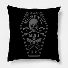 a black pillow with a skull and two crossed swords on the front that says mementoo mori