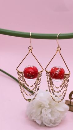 Party Earrings With Dangling Glass Beads, Glass Beaded Earrings For Gift, Handmade Glass Beaded Earrings As Gift, Glass Beaded Dangle Earrings For Gift, Red Metal Earrings For Celebration, Rose Gold Beaded Drop Earrings For Gift, Copper Beaded Earrings With Round Beads For Gifts, Handmade Glass Jewelry For Festive Occasions, Glass Beaded Earrings With Dangling Beads For Gift