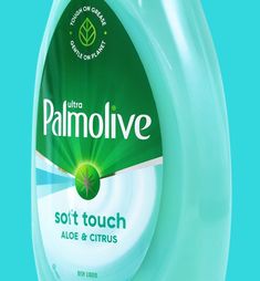 a bottle of palmolive soft touch aloe and citrus liquid on a blue background