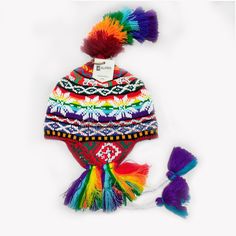 "This colorful Chullo is a handmade hat made by indigenous from the Andes in Pisac Cusco - PERU, woven in multicolored wool yarn, with ear flaps and decorated with beads all around, which are sewn one by one. This particular one has a design of the \"Andean Llama\",South American camelid from the Andean cultures. If laid flat, the Chullo alone is approximately 12\" long x 10.5\" wide. Including the pompoms on the bottom and all of the top, it measures from end to end 32\" approximately The CHULL Bohemian Knitted Alpaca Hat, Handmade Multicolor Crochet Hat In Acrylic, Handmade Multicolor Acrylic Crochet Hat, Multicolor Alpaca Bohemian Hats, Bohemian Multicolor Handmade Crochet Hat, Multicolor Hand-knitted Crochet Hat For Festivals, Multicolor Hand-knitted Bohemian Crochet Hat, Multicolor Hand Knitted Crochet Hat For Festival, Whimsical Multicolor Hand-knitted Crochet Hat