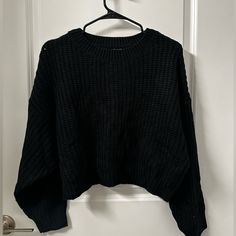 Brand New. Never Worn. Black Oversized Cropped Sweater With Crew Neck, Black Casual Cropped Sweater For Winter, Casual Black Cropped Sweater For Winter, Black Casual Cropped Sweater For Fall, Oversized Black Cropped Sweater, Trendy Cropped Black Sweater, Trendy Black Cropped Sweater For Fall, Black Cropped Sweater For Winter, Black Knitted Sweater