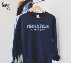 Display your nursing profession in style with this beautiful and trendy retro Peds Nurse Sweatshirt.  With a relaxed Unisex fit, this Cute Pediatric Nurse Shirt provides all day comfort and is sure to get compliments from your co-workers. This crewneck also makes a thoughtful Peds Nurse Gift for a future Pediatric Nurse or for Nurse Appreciation Week. ⭐ SIZING These popular sweatshirts are UNISEX size suitable for both men and women and have a relaxed fit. If you prefer a more fitted look, size Cotton Sweatshirt For Nursing In Fall, Cotton Nursing Sweatshirt For Fall, Cotton Nursing-friendly Relaxed Fit Sweatshirt, Cotton Relaxed Fit Nursing Sweatshirt, Casual Cotton Sweatshirt For Nursing, Popular Sweatshirts, Peds Nurse, Nurse Crewneck, Nurse Appreciation Week