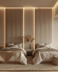 two beds in a room with beige walls