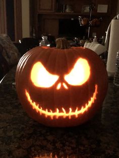 a carved pumpkin sitting on top of a counter