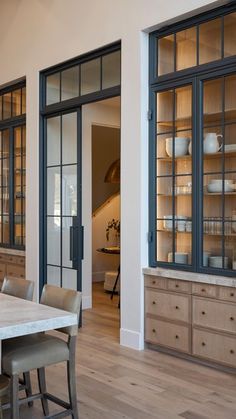 an image of a dining room with glass doors