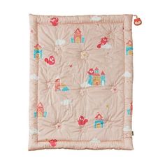 a pink baby blanket with small houses and clouds on the front, along with an orange tassel