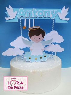 a cake with an angel on top and the word antony above it is in spanish