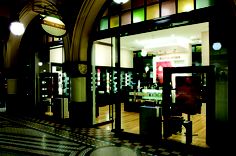 the inside of a store with many items on display in it's glass doors