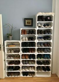 a white shoe rack filled with lots of shoes