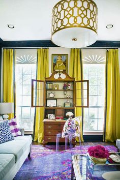 a living room with yellow drapes and curtains on the windowsills is featured in an instagram