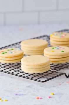 cookies on a cooling rack with confetti sprinkles