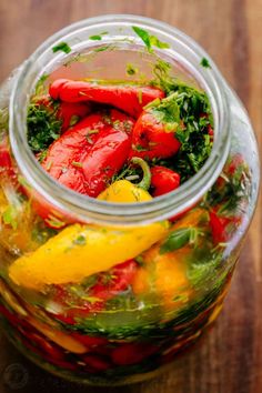 a jar filled with lots of different types of vegetables