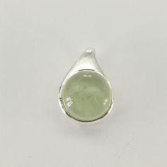 This is a beautiful Prehnite Pendant in 925 Sterling Silver. The pendant is made out of Sterling Silver with no nickel so there should be no allergic reaction and nothing will turn green. The silver is not only silver plated or steel but solid 925 Sterling Silver. We usually ship the same day in a nice gift box and we offer returns. Please note: Our jewelry is photographed close up to show detail and may appear larger than they are. We are happy to help with any questions. Green Sterling Silver Gemstones With Polished Finish, Green Polished Sterling Silver Gemstones, Green Sterling Silver Jewelry With Polished Finish, Green Sterling Silver Teardrop Pendant Jewelry, Hypoallergenic Green Sterling Silver Jewelry, Round Green Prehnite Jewelry, Green Prehnite Round Jewelry, Green Sterling Silver Pendant Gemstone, Green Sterling Silver Jewelry With Round Stone