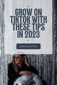 a woman holding a disco ball with the words grow on tiktok with these tips in