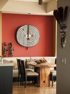 a living room filled with furniture and a large clock on the wall above it's head