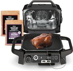 an electric grill with a chicken on it