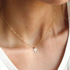 "Double Cross Dainty Necklace & Gifts for Her This double cross necklace is perfect for yourself or as a meaningful, special gift. Designed extra dainty for everyday wear in high quality 14kt gold filled to last over time!  D E T A I L S *Two super tiny cross charms, 6 & 8mm *14kt Gold dainty link chain. LENGTH *Please select from the drop down selection. *The standard length is normally 18\". *Model is wearing the mini at 16\" in Photos. HOW TO PERSONALIZE *Select your choices from the drop down menu to create your custom design. ∙ EXTRA LOVE ∙ Handcrafted just for you in sunny Arizona by a team of talented women. All of our jewelry comes gift packaged! We are happy to leave a note if this is a special gift, just let us know in the message box at checkout. PRODUCTION ∙ TIMES All items are Double Cross Necklace, Dainty Necklace Gold, Tiny Cross Necklace, Silver Gold Necklace, Cross Charm Necklace, Tiny Cross, Gold Cross Necklace, Dainty Gold Necklace, Baptism Gifts