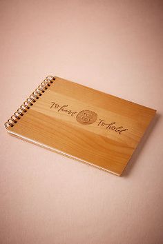 a wooden notebook with the words thank you written on it