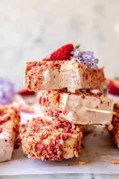 strawberries and ice cream are stacked on top of each other with marshmallows