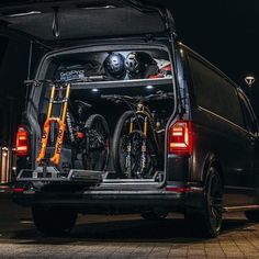 the back end of a van with bikes in it