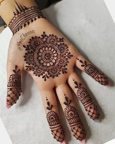 a henna tattoo on someone's hand