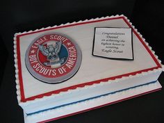 a cake with an eagle scout emblem on it