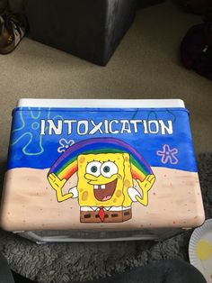 a spongebob themed lunch box with the words intoxication written on it