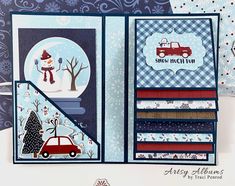 an open christmas card with a snowman and car on the front, in blue