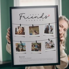 a woman holding up a poster with photos on it