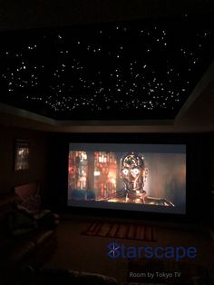 an image of a home theater with stars on the ceiling and lights in the ceiling