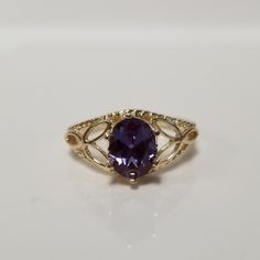 "Thanks for shopping our vintage estate store. We tend to sell well below wholesale and truly hope you enjoy all of our items. Many of the items are one of a kind, so please enjoy scrolling through the pictures and hopefully something will catch your eye. Spots are from reflections or camera. Estate 10k yellow gold created 1.5ct alexandrite cocktail filigree ring. The color of the gem is blue, purple to green with some pink, depending on light. No scratches on the gem. Stunning. Vintage setting, Antique Oval 14k Gold Topaz Ring, Antique 14k Gold Oval Topaz Ring, Antique Oval Topaz Ring In 14k Gold, Classic Oval Amethyst Ring Collectible, Vintage Oval Amethyst Ring In 14k Gold, Classic Oval Amethyst Ring With Accent Stones, Vintage Oval Sapphire Birthstone Ring, Collectible Oval Amethyst Ring In 14k Gold, Vintage Oval Sapphire Ring As Birthstone