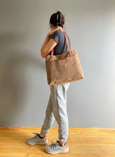 "BAG NAME : MILETOS COLOR : BEIGE ::ATTRACTIVE PRICE:: The MILETOS tote is all you need for those minimalistic days. It's perfect for holding your phone, keys, wallet, book and an iPad -- basically the most important part of your life. Our waxed canvas totes were created using the finest cotton canvas. Get it in a small or large (please ask me). ::MATERIALS AND FEATURES:: Waxed canvas Vegetable tanned leather straps Silver color Rivets An outside big slim pocket Two interior slim pockets Swivel Canvas Totes, Waterproof Tote, Bag Names, Bag Dark, Dark Beige, Waxed Canvas, Vegetable Tanned Leather, Canvas Leather, Bag Straps